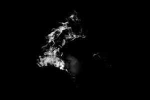 dark background with white smoke