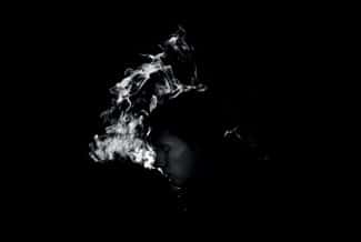 dark background with white smoke