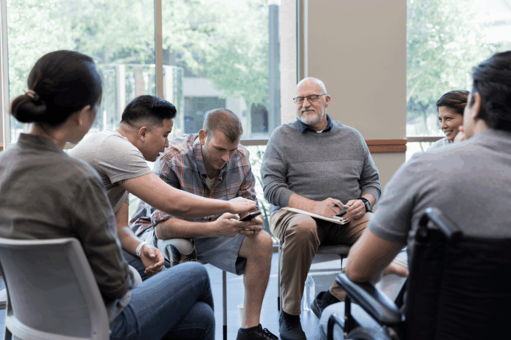 People in group therapy talking during September National Recovery Month.